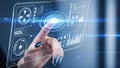 Woman interacts with glowing futuristic holographic interface displaying data analytics and system controls in blue light Royalty Free Stock Photo