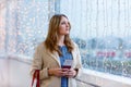 Woman at international airport waiting for flight Royalty Free Stock Photo