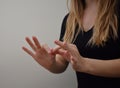 Woman interpreting sign language message to communicate