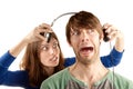 Woman interupts man with headphones Royalty Free Stock Photo
