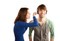 Woman interupts man with headphones Royalty Free Stock Photo
