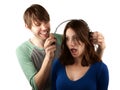 Woman interupts man with headphones Royalty Free Stock Photo