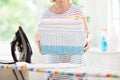 Woman ironing clothes. Home chores