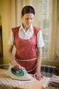 Woman Ironing in the Kitchen Royalty Free Stock Photo