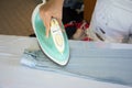 Woman ironing shirt on ironing board Royalty Free Stock Photo