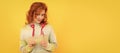 Woman isolated face portrait, banner with copy space. cheerful flirty redhead girl with red heart sticks on yellow