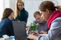 Woman isolating from business team