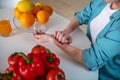 Woman itching her hand because she is alergic to products