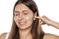 Woman with itchy ear Royalty Free Stock Photo