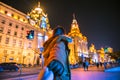 Woman in jacket clothes leading man to the bund in shanghai. Royalty Free Stock Photo