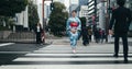 Woman, Japanese traditional dress and walking in city, zebra crossing and travel with journey outdoor. Fashion