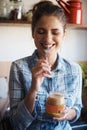 Woman, jar and peanut butter with kitchen, smile and person for food for health and wellness. Nutritionist, spread and Royalty Free Stock Photo