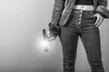 Woman in jeans is holding a gun Royalty Free Stock Photo