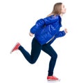 Woman in jeans and jacket running