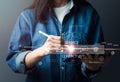 The woman in jeans is using a digital tablet and interacting with virtual contact icons on the screen ( email, address) Royalty Free Stock Photo