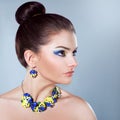 Woman in jewelry of pansies Royalty Free Stock Photo