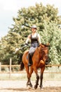 Woman jockey training riding horse. Sport activity Royalty Free Stock Photo