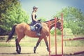 Woman jockey training riding horse. Sport activity Royalty Free Stock Photo