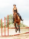 Woman jockey training riding horse. Sport activity Royalty Free Stock Photo