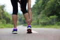 Woman jogger hold her sports injured leg Royalty Free Stock Photo