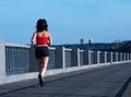 Woman jogging at the bridge