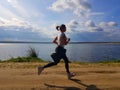 Woman jogging outdoor in summer tine. Healthy lyfestyle. Royalty Free Stock Photo