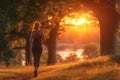 Woman is jogging in the park, Blurred sunrise background, Exercise, Health care, healthiness concept