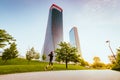 Woman jogging in the Park of the CityLife district of Milan with modern skyscrapers in the background