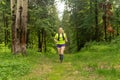 woman jogging on a trail in a natural forest park Royalty Free Stock Photo
