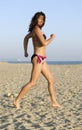 Woman joggong on beach. Royalty Free Stock Photo