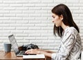 Woman journalist using computer for work