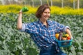 woman joyfully shows how much energy she has to work in the agricultural sector Royalty Free Stock Photo