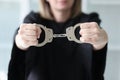 The woman judge in a black dress holds handcuffs, close-up Royalty Free Stock Photo