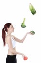 Woman juggle vegetable Royalty Free Stock Photo