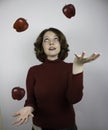 Woman juggling apples