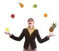 Woman juggling fruit Royalty Free Stock Photo