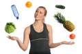 Woman Juggling Fruits Vegetables and Water Royalty Free Stock Photo