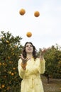 Woman Juggling Oranges