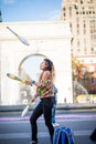 Woman Juggling with Pins, in the Middle of Greenwich Park in New Royalty Free Stock Photo