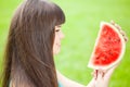 Woman with juicy watermelon in hands