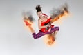 Woman in jump with a burning guitar Royalty Free Stock Photo