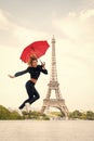 Woman jump with fashion umbrella. Happy woman travel in paris, france. Parisian isolated on white background. Girl with Royalty Free Stock Photo