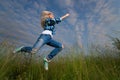 Woman jump in green grass field Royalty Free Stock Photo