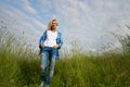 Woman jump in green grass field Royalty Free Stock Photo