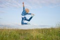 Woman jump in green grass field Royalty Free Stock Photo