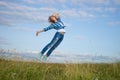 Woman jump in green grass field Royalty Free Stock Photo