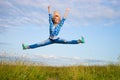 Woman jump in green grass field Royalty Free Stock Photo