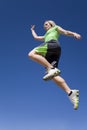 Woman jumpin with blue sky