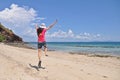 WOMAN JUMPING ON BEACH Royalty Free Stock Photo