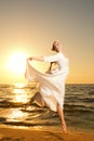 Woman jumping on a beach Royalty Free Stock Photo